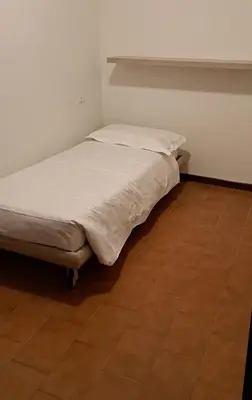 Letto o letti in una camera di APPARTAMENTO SERENA