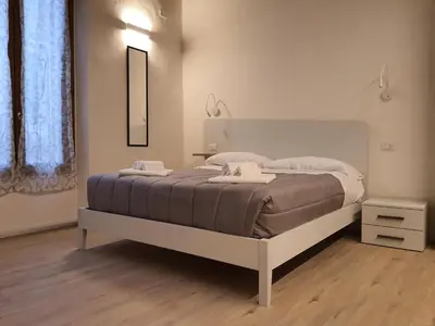 Letto o letti in una camera di RESIDENZA I PORTICI