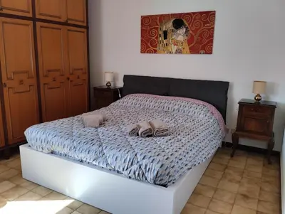 Letto o letti in una camera di Appartamento con posto auto privato comodo a centro e spiagge