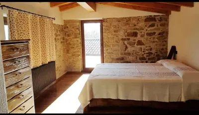 Letto o letti in una camera di Case Apuane