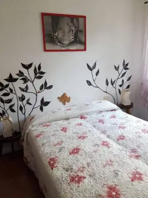 Letto o letti in una camera di Case Apuane