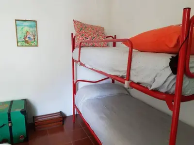 Letto o letti in una camera di Case Apuane