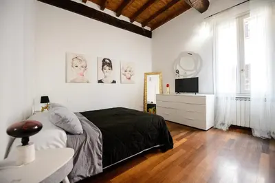 Letto o letti in una camera di PINK HOUSE TORTELLINOSUITE Modena