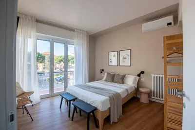 Letto o letti in una camera di 223 - Ma & Ma Luxury Apartment 1 grande - 500metri da mare e spiaggia, vicino alla Baia del Silenzio - PARCHEGGIO GRATIS PRIVATO INCLUSO