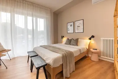 Letto o letti in una camera di 223 - Ma & Ma Luxury Apartment 1 grande - 500metri da mare e spiaggia, vicino alla Baia del Silenzio - PARCHEGGIO GRATIS PRIVATO INCLUSO