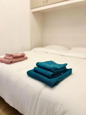 Letto o letti in una camera di Pavia in Charme - Intero Appartamento