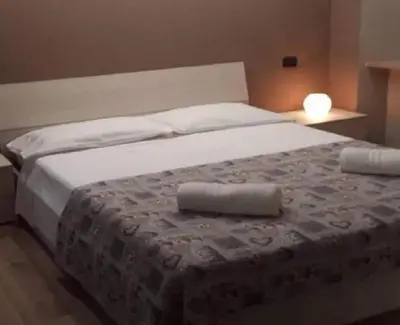 Letto o letti in una camera di Hotel fitness