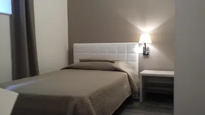 Letto o letti in una camera di Sabbia d'Oro locanda & beach
