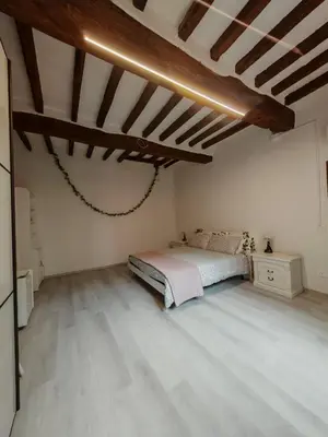 Letto o letti in una camera di La Sosta-appartamento a pochi passi dalla stazione
