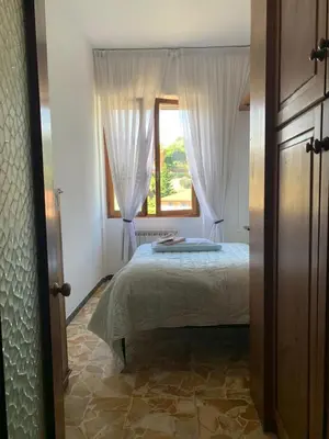Letto o letti in una camera di Casa Martina