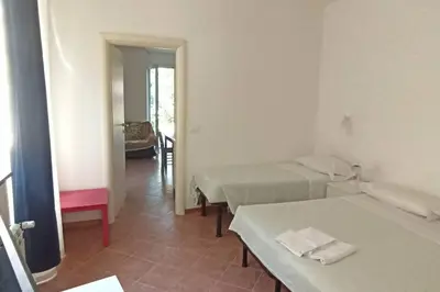 Letto o letti in una camera di Villa tranquilla immersa nel verde a 2 Km dal mare