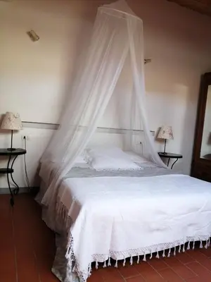 Letto o letti in una camera di Az. Agr. IL PARADISO di Beatrice Bondielli
