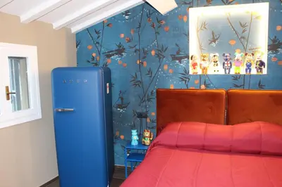 Letto o letti in una camera di ALTANA HOUSE TORTELLINOSUITE Modena