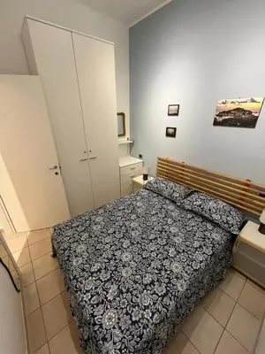 Letto o letti in una camera di LA CASA DEI POPPI