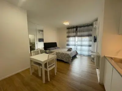 Letto o letti in una camera di Monolocale con Terrazzo