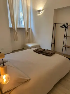 Letto o letti in una camera di Splendido Loft Centro Storico Parma