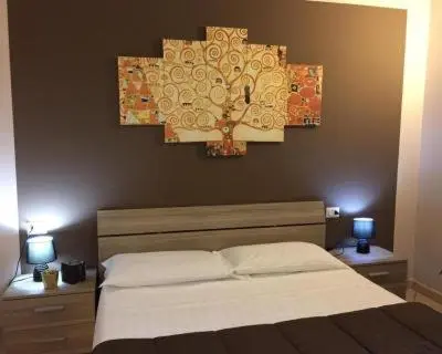 Letto o letti in una camera di Residence CHECKIN A RICHIESTA