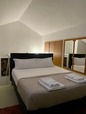 Letto o letti in una camera di 149 BORGO TICINO SUITE Attico di Lusso con Terrazzo e Parking Privato