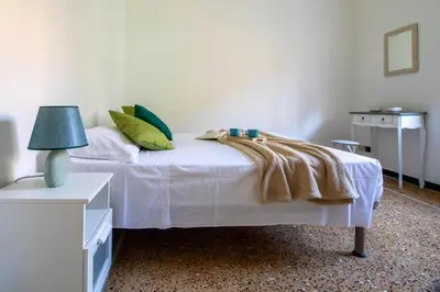 Letto o letti in una camera di CASA MARGHERITA