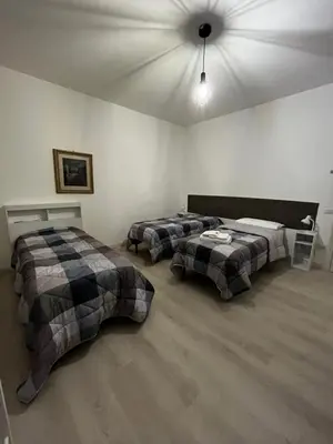 Letto o letti in una camera di R&B Emilia