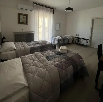 Letto o letti in una camera di R&B Emilia