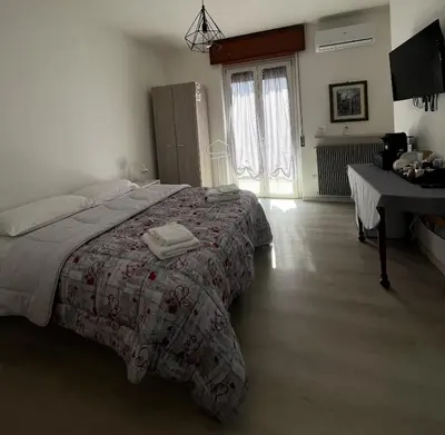 Letto o letti in una camera di R&B Emilia