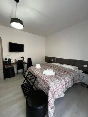Letto o letti in una camera di R&B Emilia