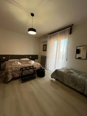 Letto o letti in una camera di R&B Emilia