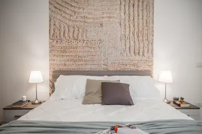 Letto o letti in una camera di *Casa MULiNO - Storia e modernità*