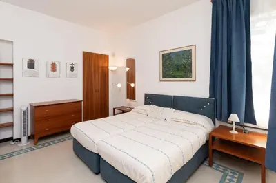 Letto o letti in una camera di Villa Nettuno- Bluchalet