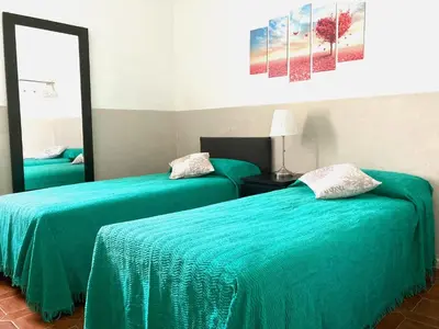 Letto o letti in una camera di Pae veciu casa vacanze
