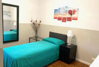 Letto o letti in una camera di Pae veciu casa vacanze