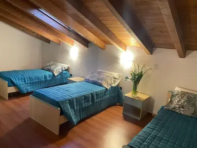 Letto o letti in una camera di SUITE DEGLI ARTISTI RCF Arena