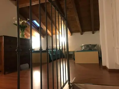 Letto o letti in una camera di SUITE DEGLI ARTISTI RCF Arena