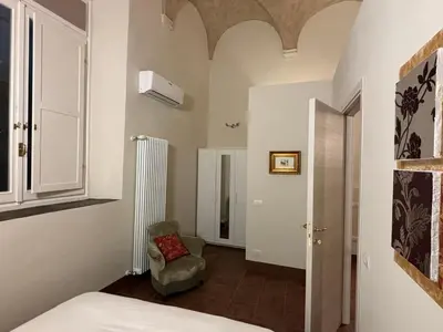 Letto o letti in una camera di Appartamento L'antica colonna, in centro storico