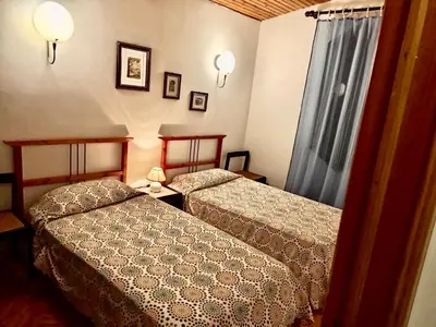 Letto o letti in una camera di Casa del toni