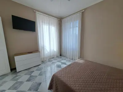 Letto o letti in una camera di APPARTAMENTO ESTHER Levanto