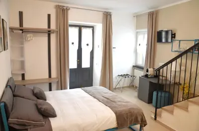 Letto o letti in una camera di Pae veciu camera privata con bagno