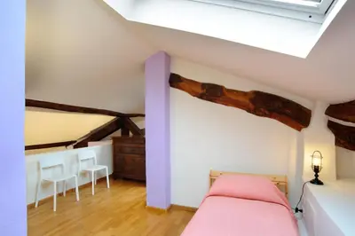 Letto o letti in una camera di SM Hospitality SANTO STEFANO
