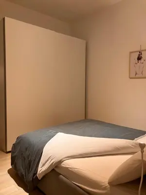 Letto o letti in una camera di ROSSENA HOME tranquillo appartamento, con giardino, vicino al centro ed all'Ospedale Santa Maria Nuova SMN