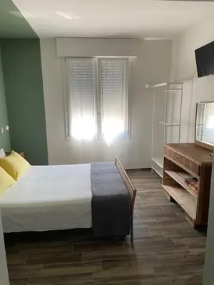 Letto o letti in una camera di B&B IL CEDRO