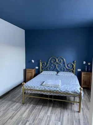 Letto o letti in una camera di B&B IL CEDRO