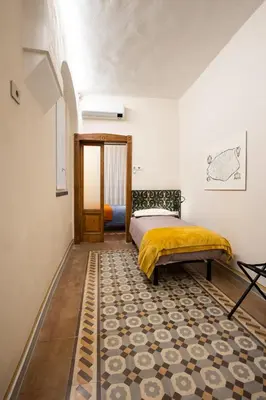 Letto o letti in una camera di Locanda del Centrale