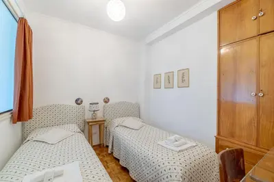 Letto o letti in una camera di GuestHost - Vintage Holiday Flat