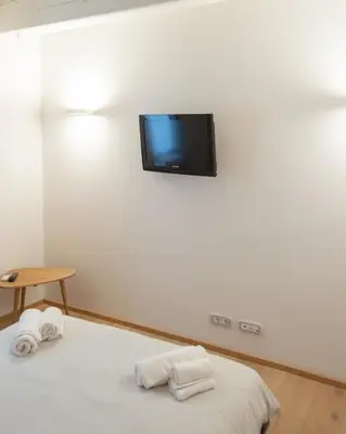 Letto o letti in una camera di White Moon crema & Parking