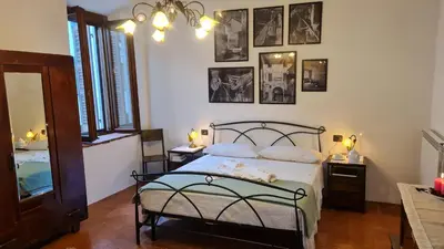 Letto o letti in una camera di Casa delle rondini