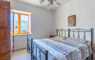 Letto o letti in una camera di Cozy Home In Comano With Wifi