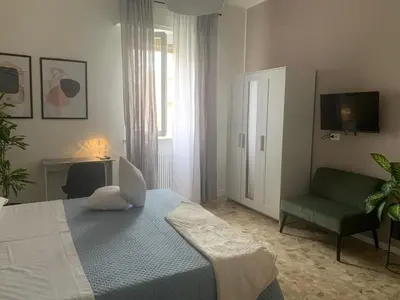 Letto o letti in una camera di b&b Calvino