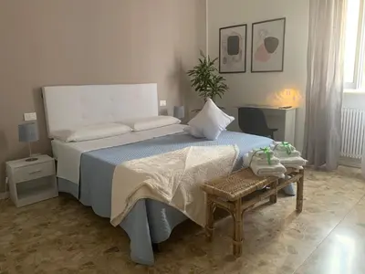 Letto o letti in una camera di b&b Calvino