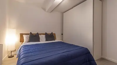 Letto o letti in una camera di Suite Rua Pioppa - Affitti Brevi Italia
